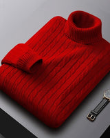 Close-up of cable knit texture on the body of the jumper