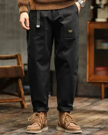 Side profile of men's cargo trousers showing wide-leg silhouette