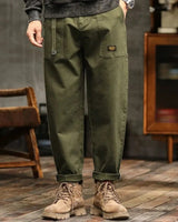 Men's cargo trousers with wide-leg cut and structured panel lines, front view
