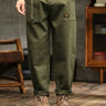 Men's cargo trousers with wide-leg cut and structured panel lines, front view