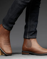 Side view of men's Chelsea boot showing elasticated gusset and stacked block heel