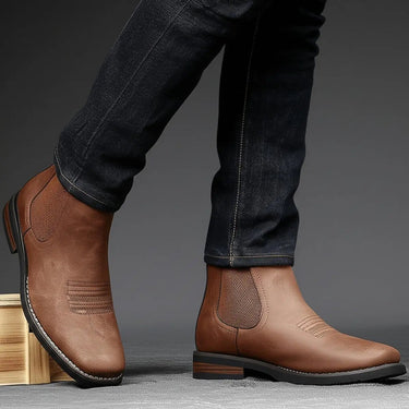 Side view of men's Chelsea boot showing elasticated gusset and stacked block heel