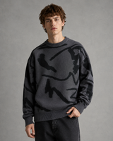 Full-length view of men's abstract graphic knit jumper with joggers