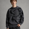 Full-length view of men's abstract graphic knit jumper with joggers