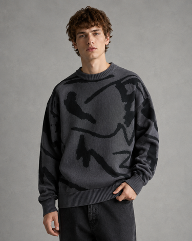 Full-length view of men's abstract graphic knit jumper with joggers