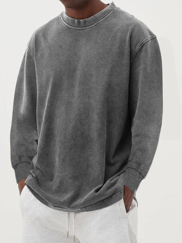 Side profile of men's chunky knit jumper showing dropped shoulder detail