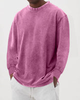 Close-up of chunky knit texture on men's crew neck jumper