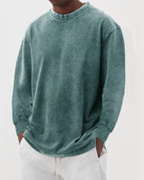Men's chunky knit jumper worn casually, showing overall relaxed silhouette