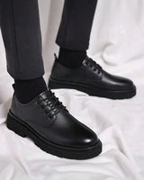 Men's chunky derby boots with lace-up closure and rounded toe, front view