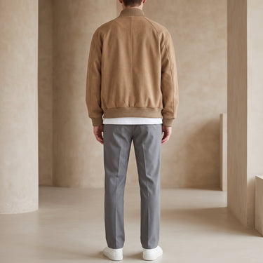 Side view showing the relaxed silhouette and ribbed hem of the jacket