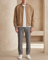 Front view of a faux leather bomber jacket with stand-up collar and zip closure