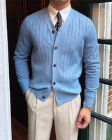 Front view of a men's fine knit ribbed cardigan with V-neck and button front