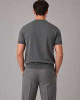Close-up of ribbed crew neckline on men's fine knit short-sleeve jumper