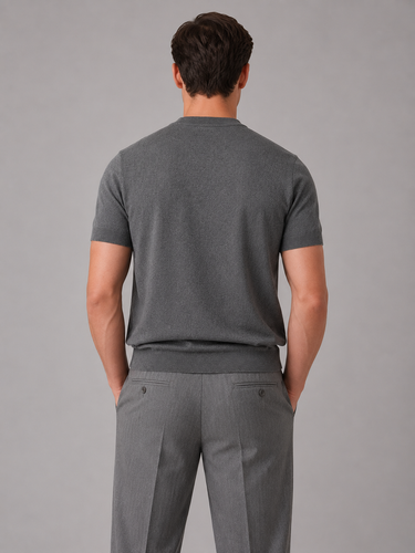 Close-up of ribbed crew neckline on men's fine knit short-sleeve jumper