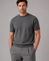 Men's fine knit jumper showing ribbed cuffs and hem detail, side view