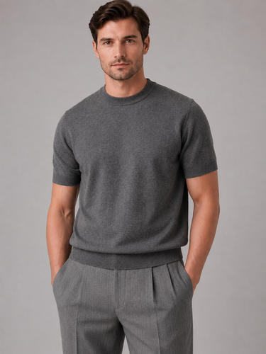 Men's fine knit jumper showing ribbed cuffs and hem detail, side view