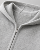 Close-up of the full-length zip and ribbed cuffs on the knit hoodie
