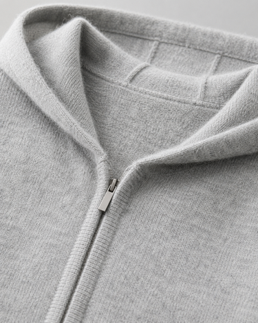 Close-up of the full-length zip and ribbed cuffs on the knit hoodie