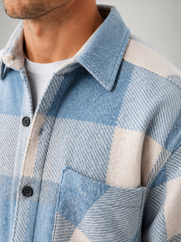 Rear view of men's plaid flannel overshirt with relaxed fit