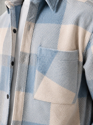 Men's flannel overshirt with buttoned cuffs, detail shot