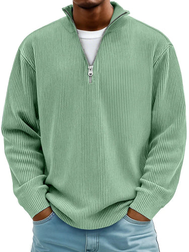 Side profile of the oversized half zip jumper showing the loose silhouette