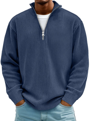 Close-up of the metal zip and raised collar detail at the neckline