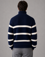 Side view of men's striped half zip knitted jumper showing dropped shoulders and long sleeves
