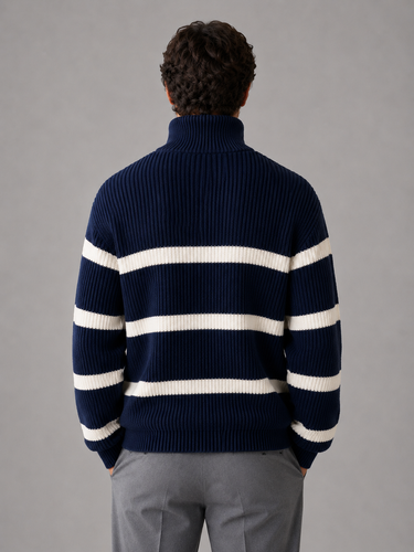 Side view of men's striped half zip knitted jumper showing dropped shoulders and long sleeves