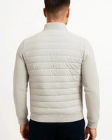 Model wearing the hybrid jacket in a casual street setting