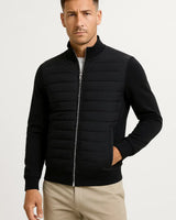Front view of a men's hybrid jacket with quilted front panel and knitted sleeves