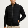 Front view of a men's hybrid jacket with quilted front panel and knitted sleeves