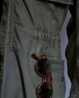 Rear view of the military-style field jacket with straight hem