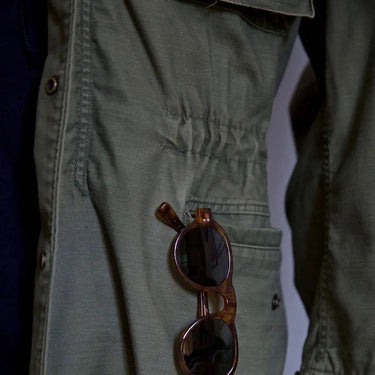 Rear view of the military-style field jacket with straight hem