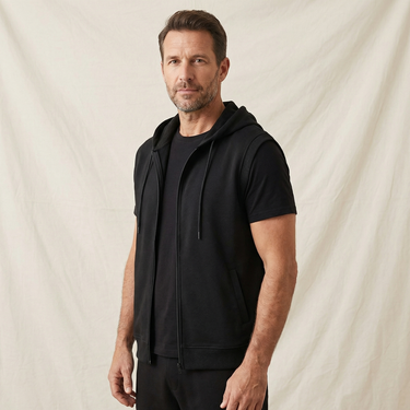 Flat lay of the sleeveless zip-up hoodie vest showing overall shape and silhouette