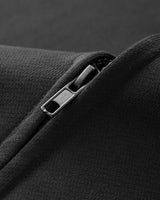 Three-quarter rear view of the sleeveless hoodie vest showing the hood and back panel