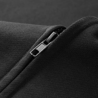 Three-quarter rear view of the sleeveless hoodie vest showing the hood and back panel