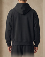 Three-quarter view of heavyweight men's hoodie showing overall silhouette