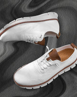 Side profile of men's low-cut lace-up boots showing segmented sole