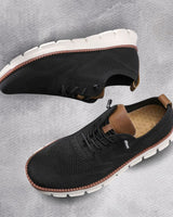Detail shot of lace-up fastening on men's casual boots