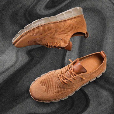 Rear view of men's lace-up boots highlighting sole construction