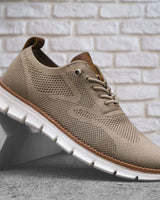 Men's lace-up boots with textured upper and segmented sole, front view