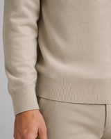 Men's knitted polo shirt layered under a blazer