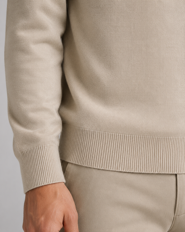 Men's knitted polo shirt layered under a blazer