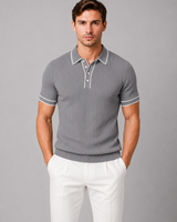 Close-up of contrast tipping detail on collar of men's knitted polo shirt