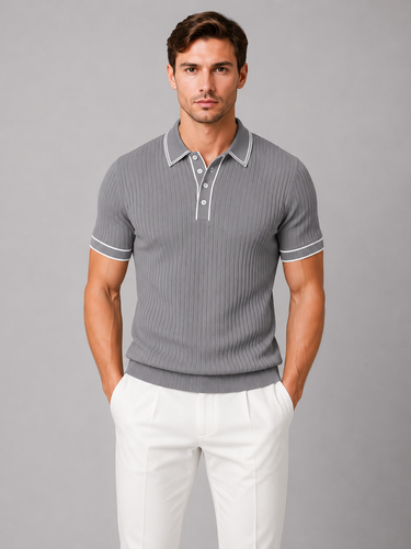Close-up of contrast tipping detail on collar of men's knitted polo shirt