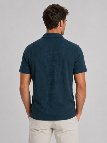 Side profile of men's knitted polo shirt showing tailored silhouette