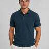 Front view of men's textured knit polo shirt with structured collar and button placket