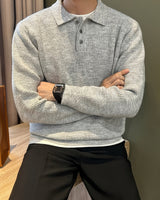 Side view of a men's ribbed knitted polo shirt showing sleeve and hem detail