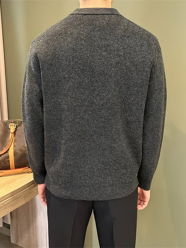 Three-quarter view of a men's ribbed knitted polo shirt worn casually