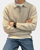 Front view of a men's long-sleeve knitted polo shirt with ribbed texture and button placket